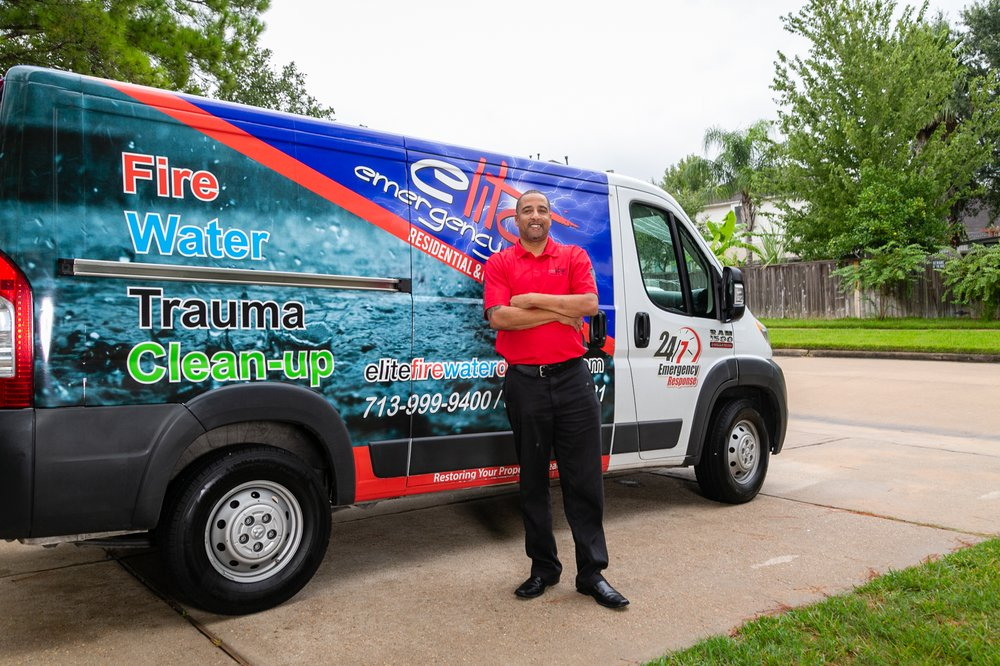 Erick Ashe, owner / operator of Elite Emergency Solutions, beside a company response vehicle